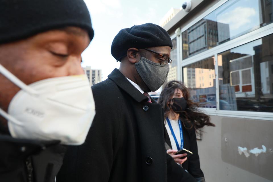 Former Detroit City Council Member Andre L. Spivey walks out of federal court after being sentenced for two years after pleading guilty in his corruption and bribery case in Detroit on Wednesday, Jan. 19, 2022. 