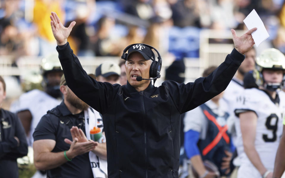 Wake Forest head coach Dave Clawson raises his hands after a touchdown during the first half of an NCAA college football game against Duke in Durham, N.C., Saturday, Nov. 26, 2022. (AP Photo/Ben McKeown)