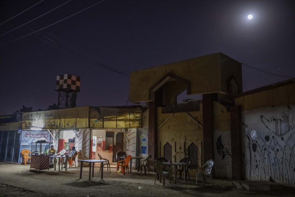 This Jan. 12, 2020 photo shows men drinking tea on a street just blocks away from the Khartoum Ophthalmology Hospital and a mosque where dozens of women were raped during the June 3, 2019 crackdown on a protest camp, in Khartoum, Sudan. The Associated Press spoke to six rape victims. They told similar stories of paramilitary fighters corralling up men and women who fled the protest site, beating them, sexually molesting the women and gang-raping some. By their accounts, the rapes took place in specific locations -- in a medical complex, a cemetery and the grounds of Khartoum University’s mosque. (AP Photo/Nariman El-Mofty)