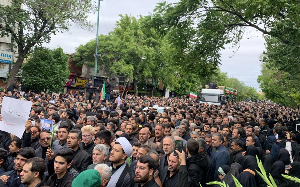 Iranians turn out to see Raisi's coffin in Tabriz.