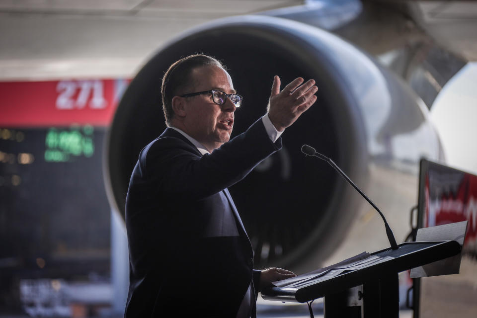 SYDNEY, AUSTRALIA - JULY 22: Alan Joyce, CEO of Qantas, speaks in front of the Qantas Boeing 747-400, registration VH-OEJ, during an official ceremony before it takes off at Sydney Airport for the last time as it retires from service on July 22, 2020 in Sydney, Australia. Flight QF7474 took off in the early afternoon to begin the fleet's early retirement from Qantas' services, which was originally scheduled in six months' time but was changed due to the devastating effects of COVID-19 on global travel. Thousands of spectators lined the airport perimeter to watch the 