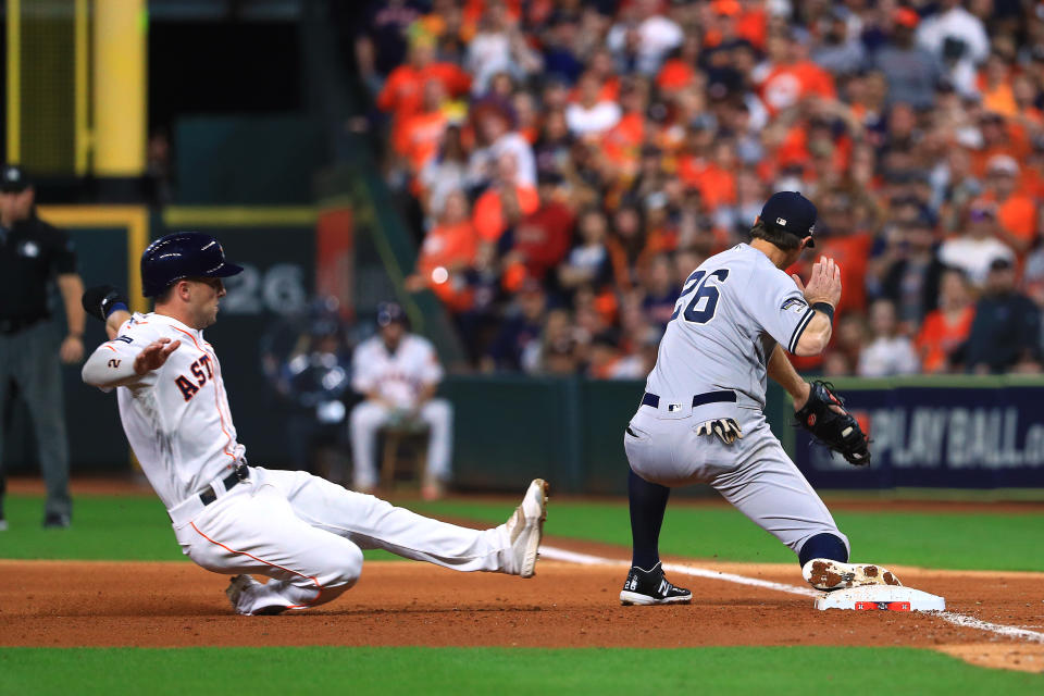 New York's DJ LeMahieu (26) completes the double play on Houston's Alex Bregman during Game 1 of the ALCS on Saturday. (Getty)