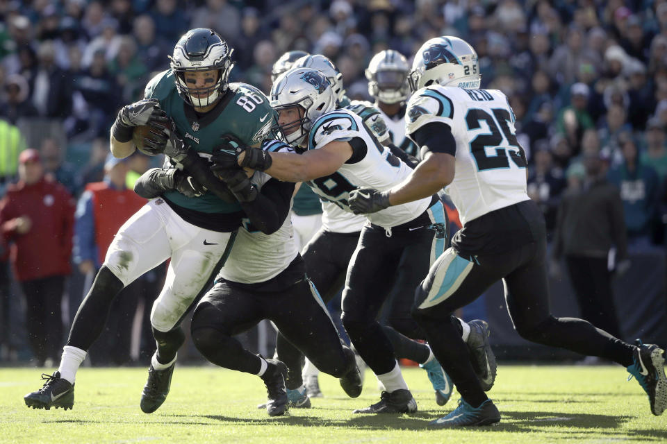 <p>Philadelphia Eagles quarterback Carson Wentz (11) is tackled by a host of Carolina Panthers defenders during the second half of an NFL football game, Sunday, Oct. 21, 2018, in Philadelphia. (AP Photo/Matt Rourke) </p>