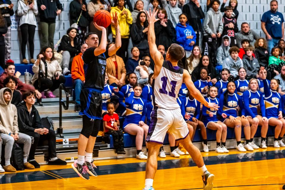 Wareham's Jayce Travers hits the baseline three.