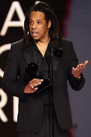 <p>Kevin Winter/Getty </p> Honoree JAY-Z accepts the Dr. Dre Global Impact Award onstage during the 66th GRAMMY Awards at Crypto.com Arena in February 2024 in Los Angeles