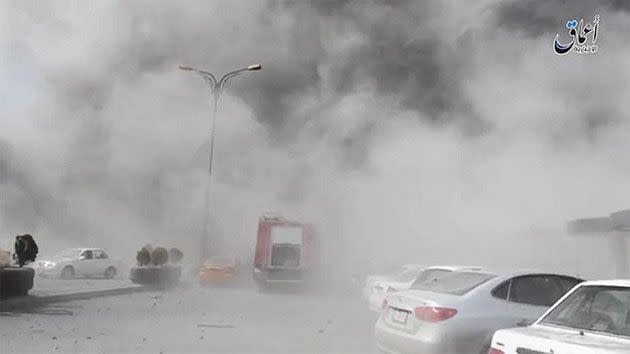 Clouds of grey smoke billow out onto the streets of Mosul. Photo: Mosul Eye