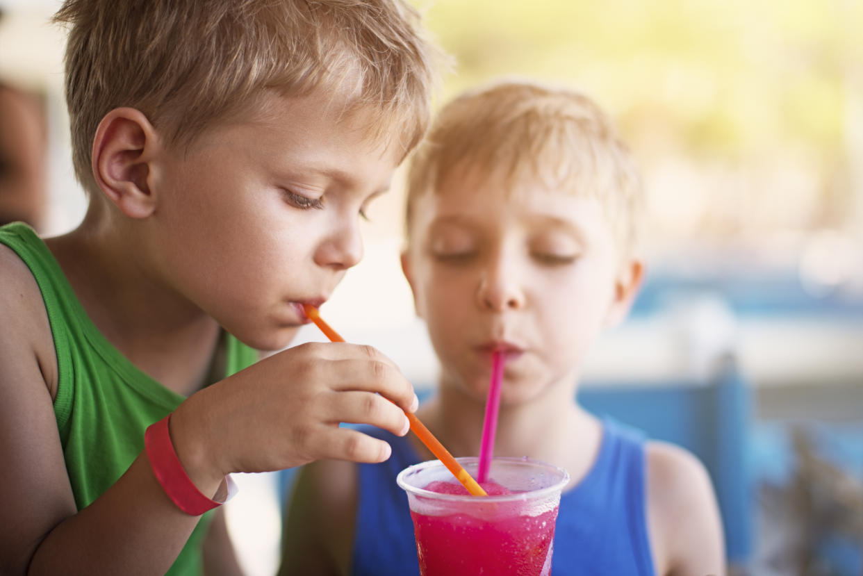 Boys drinking a slushie drink. (Getty Images)