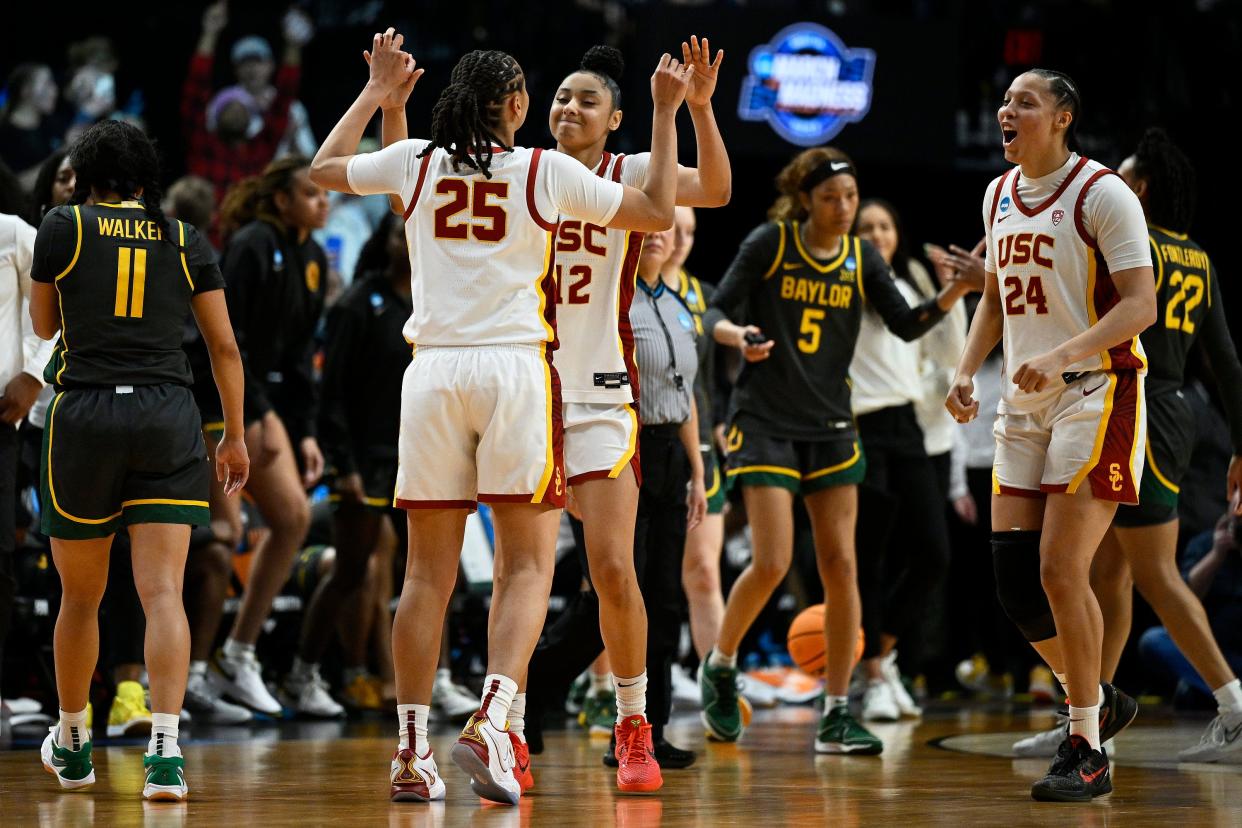 JuJu Watkins (12) celebrates with McKenzie Forbes (25) after Southern Cal defeated Baylor.