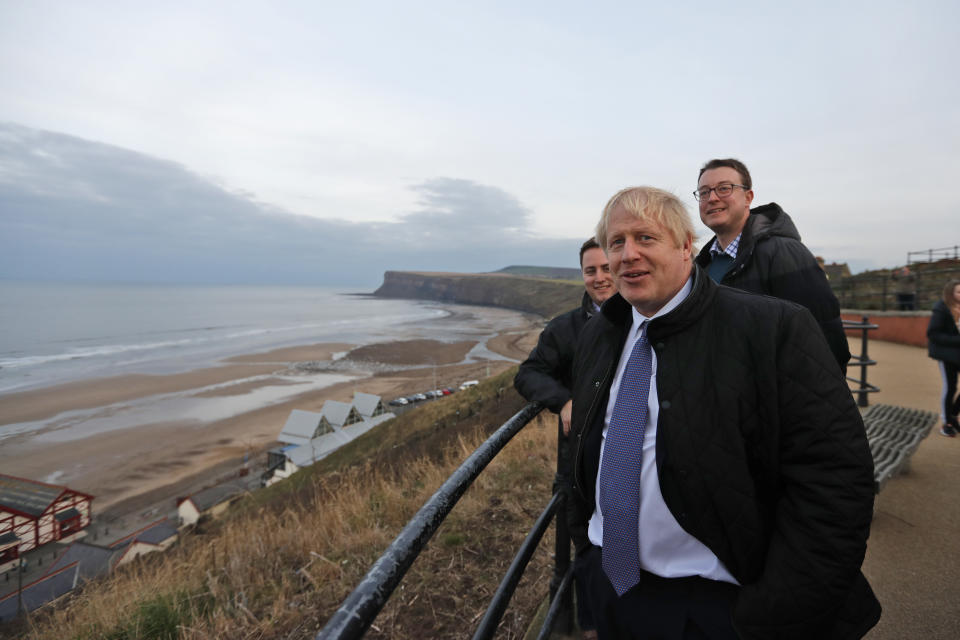 Britain's Prime Minister Boris Johnson looks out over the sea during a General Election campaign trail stop in Saltburn-by-the-Sea, near Middlesbrough, England, Wednesday, Nov. 20, 2019. Britain goes to the polls on Dec. 12. (AP Photo/Frank Augstein, Pool)