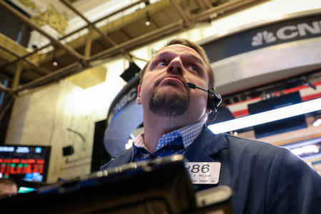 FILE PHOTO: A trader works on the floor of the New York Stock Exchange (NYSE) in New York, U.S., Jan. 10, 2019. REUTERS/Brendan McDermid/File Photo
