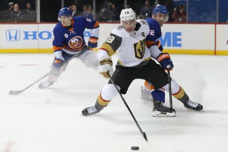 Dec 12, 2018; Brooklyn, NY, USA; Vegas Golden Knights center Tomas Nosek (92) and New York Islanders defenseman Nick Leddy (2) battle for the puck during the third period at Barclays Center. Mandatory Credit: Brad Penner-USA TODAY Sports