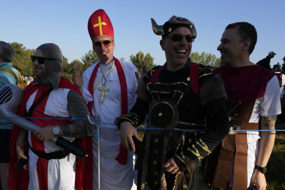 European fans in fancy costumes line the 16th fairway as they watch the morning Foursomes matches at the Ryder Cup golf tournament at the Marco Simone Golf Club in Guidonia Montecelio, Italy, Saturday, Sept. 30, 2023. (AP Photo/Alessandra Tarantino)