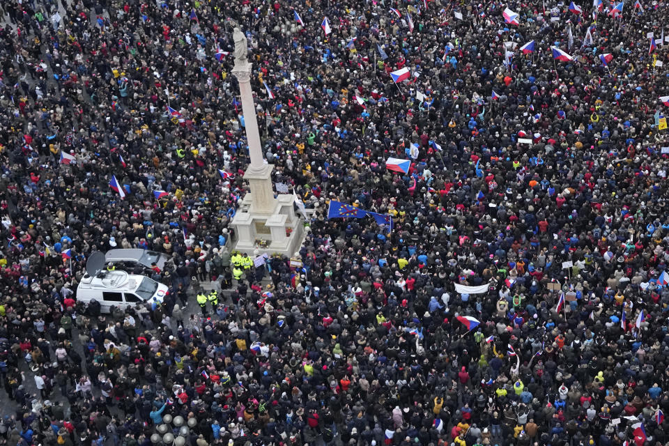 FILE - Demonstrators gather to protest against the government restriction measures to curb the spread of COVID-19 during celebrations of the 32nd anniversary of the pro-democratic Velvet Revolution that ended communist rule in 1989 in Prague, Czech Republic, Wednesday, Nov. 17, 2021. This was supposed to be the Christmas in Europe where family and friends could once again embrace holiday festivities and one another. Instead, the continent is the global epicenter of the COVID-19 pandemic as cases soar to record levels in many countries.(AP Photo/Petr David Josek, File)