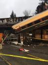 <p>A derailed train falls onto I-5 South in Olympia, WA. (Photo: Trooper Brooke Bova/Wash St. Patrol) </p>