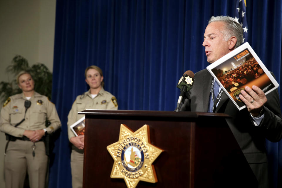 Clark County Sheriff Joe Lombardo announces the release of the Oct. 1, 2017, shooting After-Action Review with report authors Detective Stephanie Ward, left, and Capt. Kelly McMahill during a news conference at Metropolitan Police Department headquarters Las Vegas Wednesday, July 10, 2019. The report details what the department learned from the deadliest mass shooting in modern U.S. history. (K.M. Cannon/Las Vegas Review-Journal via AP)