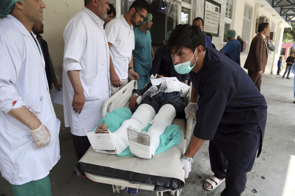 An injured man is carried into a hospital after a car bomb explosion in Kabul, Afghanistan, Thursday, Sept. 5, 2019. A car bomb rocked the Afghan capital on Thursday and smoke rose from a part of eastern Kabul near a neighborhood housing the U.S. Embassy, the NATO Resolute Support mission and other diplomatic missions. (AP Photo/Rahmat Gul)