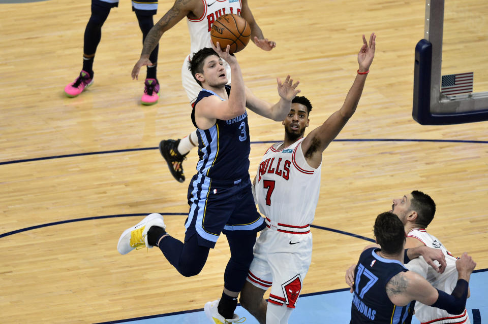 Memphis Grizzlies guard Grayson Allen (3) shoots against Chicago Bulls forward Troy Brown Jr. (7) in the second half of an NBA basketball game Monday, April 12, 2021, in Memphis, Tenn. (AP Photo/Brandon Dill)