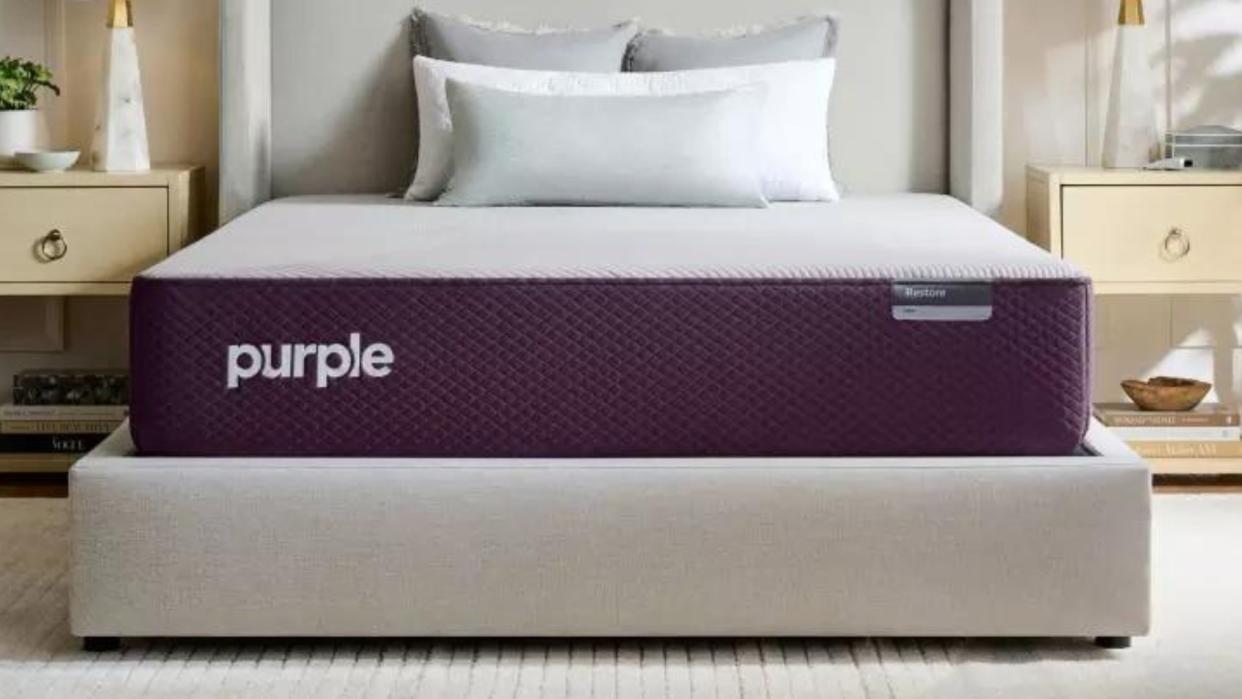  The Purple Restore Hybrid Mattress in a neutral bedroom. 