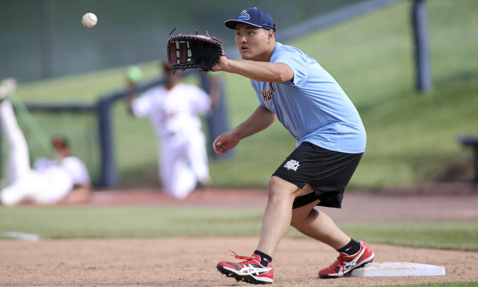 Trenton Thunder first baseman Rintaro Sasaki (49) makes a catch at first base before a baseball game against the Frederick Keys, Tuesday, June 11, 2024, in Frederick, Md. The 19-year-old prospect will make his U.S. debut Tuesday in the MLB Draft League, playing for the Trenton Thunder of New Jersey along with others hoping to one day develop into major leaguers.(AP Photo/Daniel Kucin Jr.)