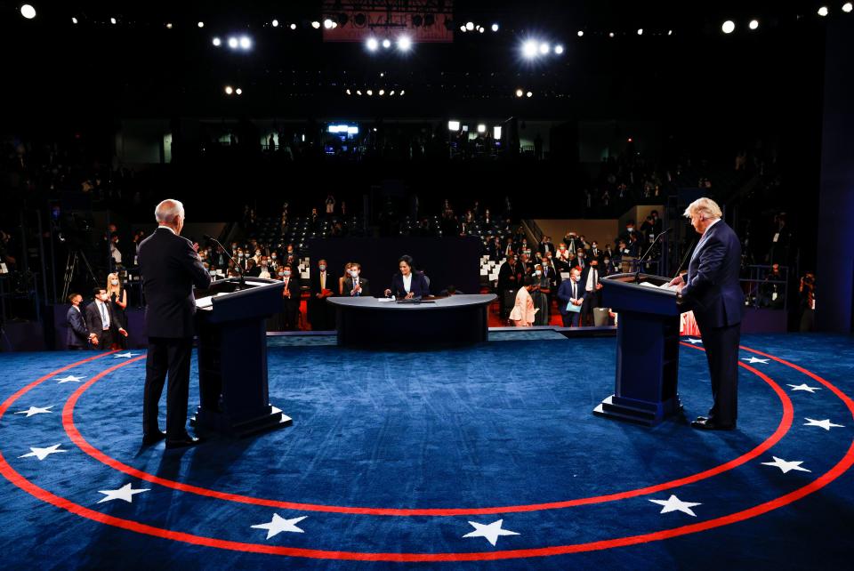 Former Vice President Joe Biden, left, and President Donald Trump debate Thursday, with moderator Kristen Welker in the middle.