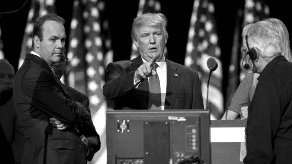 Then-GOP presidential candidate Donald Trump on stage with Rick Gates, left, at the Republican National Convention, July 21, 2016, in Cleveland. (Evan Vucci/AP)