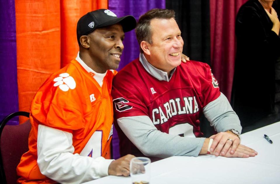 Clemson Tigers legend Terry Kinard and South Carolina Gamecocks legend Todd Ellis pose for a photo during A Night with The Stars at Seawells, a Clemson/South Carolina fundraising event to benefit the Palmetto Health Richland Trauma Unit.