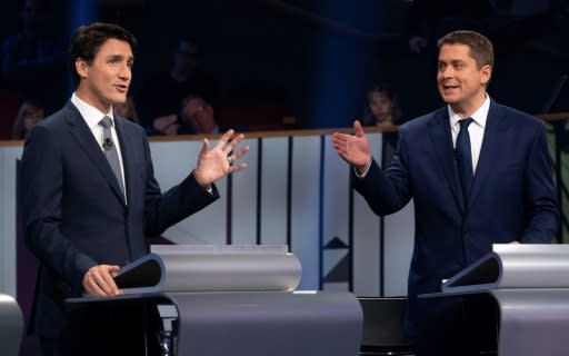 Prime Minister and Liberal leader Justin Trudeau (L) and Conservative leader Andrew Scheer faced off during a debate in Gatineau, Quebec, on October 10, 2019; the two differ sharply on questions of energy and the environment