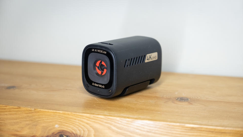 AnkerWork C310 webcam on a wooden surface