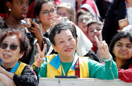 A faithful from China gestures as she attends the weekly general audience in the Vatican, May 22, 2019. REUTERS/Remo Casilli