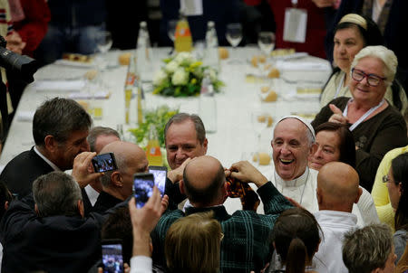Pope Francis smiles before sharing a lunch with the poor following a special mass to mark the new World Day of the Poor in Paul VI's hall at the Vatican, November 19, 2017. REUTERS/Max Rossi
