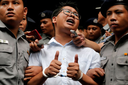 FILE PHOTO: Reuters journalist Wa Lone leaves after listening to the verdict at Insein court in Yangon, Myanmar, September 3, 2018. REUTERS/Myat Thu Kyaw/File Photo