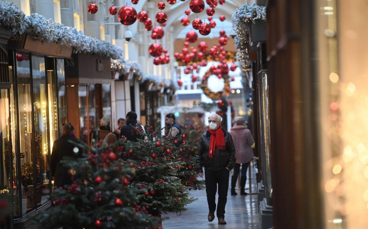 Boris Johnson urged families to keep their Christmas celebrations as small as possible - EPA
