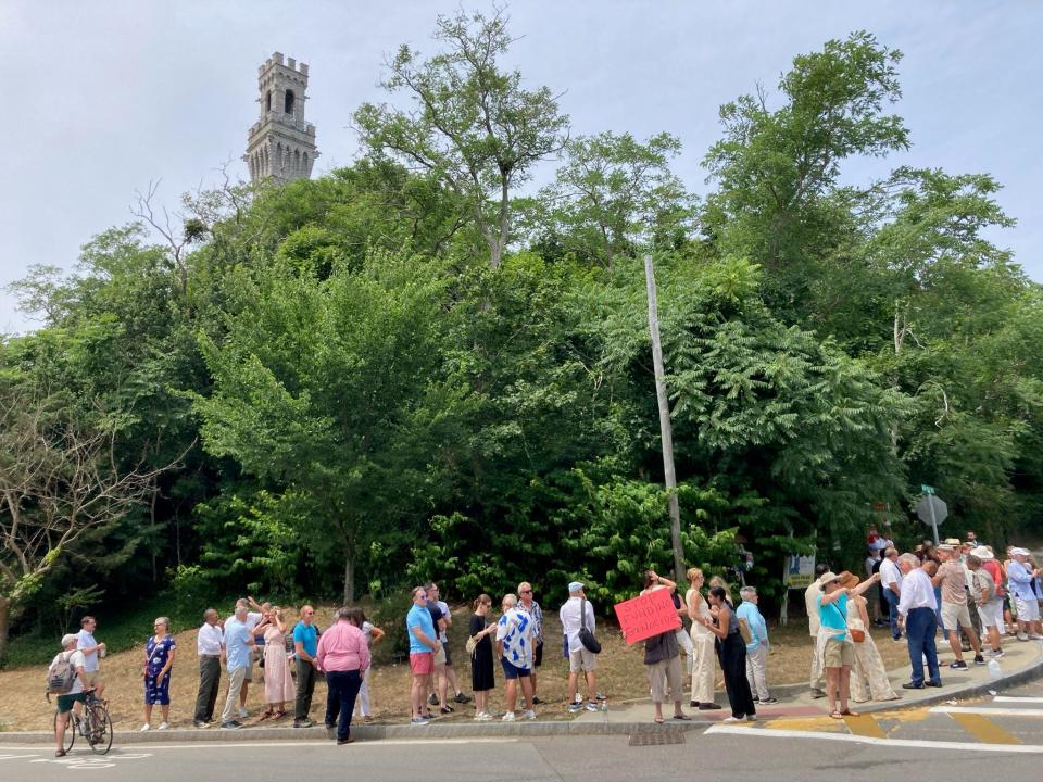 Attendees of the fundraising reception with Vice President Kamala Harris at the Pilgrim Monument and Provincetown Museum line up at the Bradford Street entrance Saturday at noon.