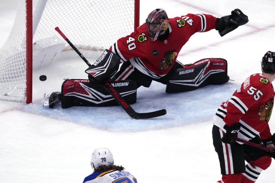 Chicago Blackhawks goaltender Arvid Soderblom saves a shot by St. Louis Blues center Oskar Sundqvist during the second period of an NHL hockey game in Chicago, Sunday, Nov. 26, 2023. (AP Photo/Nam Y. Huh)