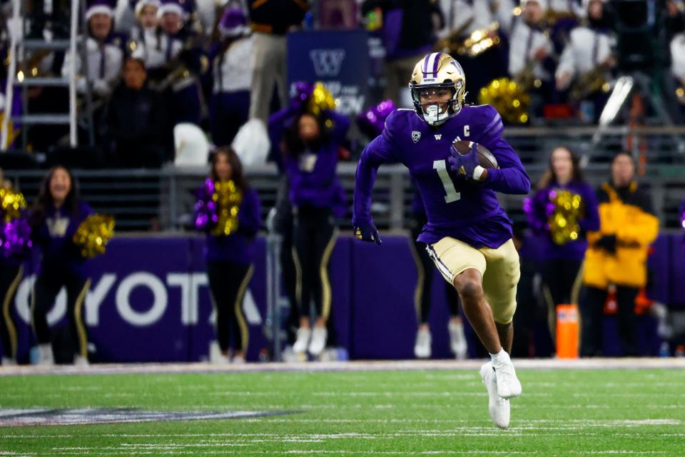 Washington Huskies wide receiver Rome Odunze (1) rushes against the Washington State Cougars during the fourth quarter at Alaska Airlines Field at Husky Stadium in Seattle on Nov. 25, 2023.