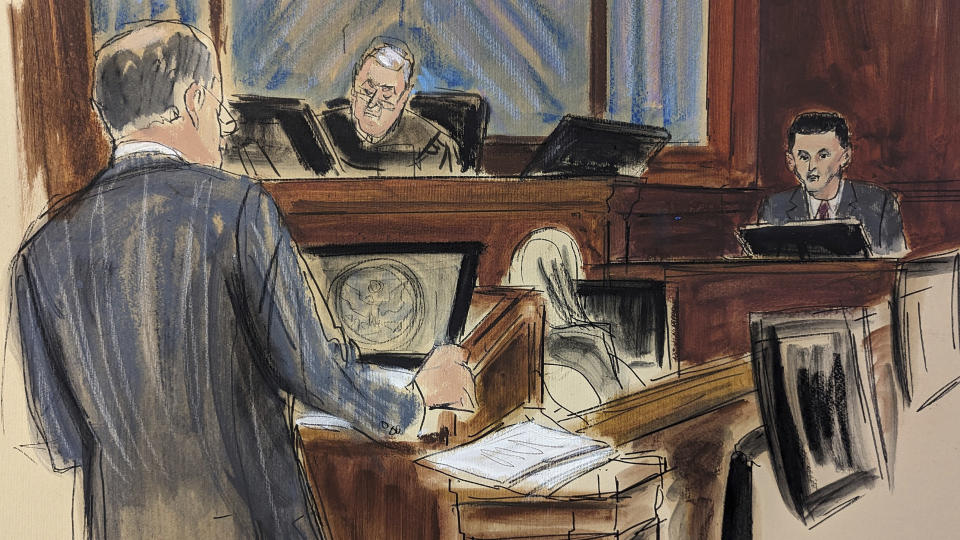 In this courtroom sketch, FTX founder Sam Bankman-Fried, right, is questioned by his attorney, Mark Cohen, left, as Judge Lewis Kaplan listens on the bench, center, during his trial in Manhattan federal court, Thursday, Oct. 26, 2023, in New York. (Elizabeth Williams via AP)