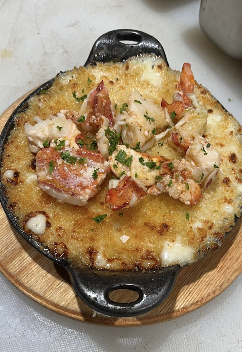 Corvina Seafood Grill's take on mac and cheese features butter-poached Maine lobster nestled into pasta drenched in a white cheddar mornay sauce and topped with toasted panko.