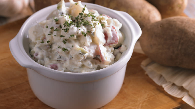 Potato salad in white bowl