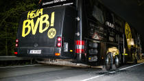 <p>The rear of the team bus is seen after explosions rocked it </p>