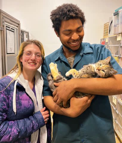 <p>Brother Wolf Animal Rescue</p> Lilly the cat with the junkyard employee that helped save her life at the Brother Wolf Animal Rescue in North Carolina