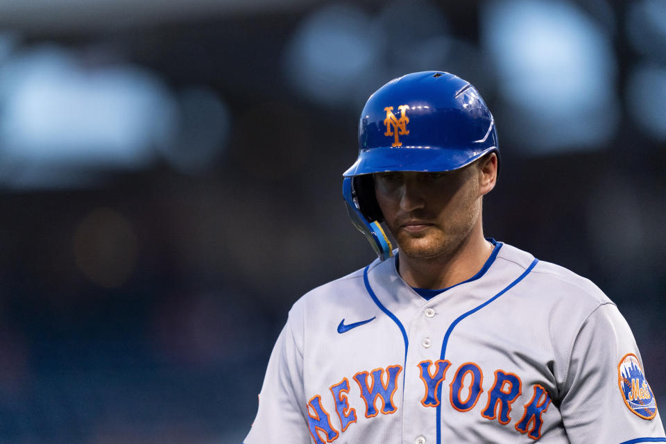 New York Mets' Brandon Nimmo returns to the dugout after striking out swinging on a pitch by Washington Nationals starting pitcher Joan Adon during the second inning of a baseball game, Wednesday, Sept. 6, 2023, in Washington. (AP Photo/Stephanie Scarbrough)