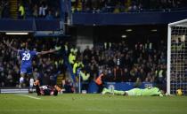 Chelsea's Samuel Eto'o (L) celebrates scoring a goal past West Bromwich Albion's goalkeeper Boaz Myhill (R) during their English Premier League soccer match at Stamford Bridge in London November 9, 2013.