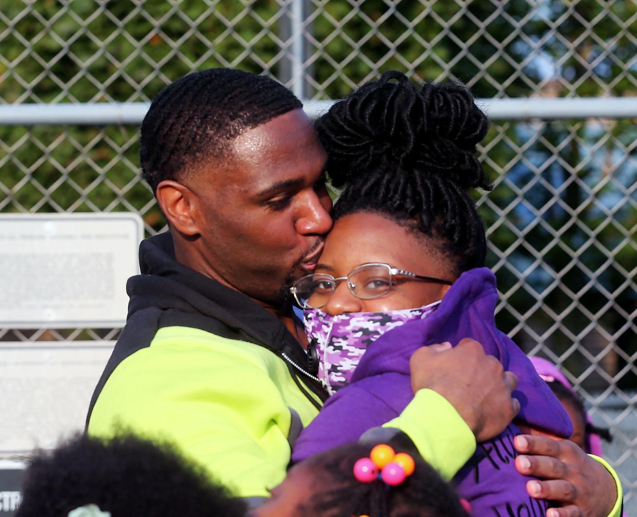 Marlin Dixon, left,  embraces his daughter  Kamariya Dixon, right, on Tuesday, Sept. 22, 2020, after he was released from the John C. Burke Correctional Center. His daughter was 5 months old when he was sentenced to 18 years in prison for the death of Charlie Young Jr.