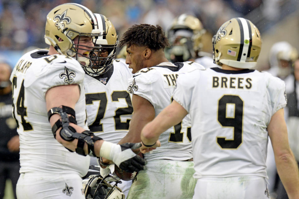 New Orleans Saints wide receiver Michael Thomas, center, celebrates with teammates after scoring a touchdown on a 2-yard pass reception against the Tennessee Titans in the second half of an NFL football game Sunday, Dec. 22, 2019, in Nashville, Tenn. The Saints won 38-28. (AP Photo/James Kenney)