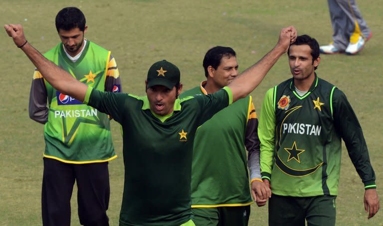 Pakistan fast bowler Mohammad Irfan stretches during a practice session at the Gaddafi stadium in Lahore on December 15, 2012. A towering man of seven feet one inch, fast-rising Pakistan paceman Irfan often struggles to find bowling shoes that fit and a comfortable bed