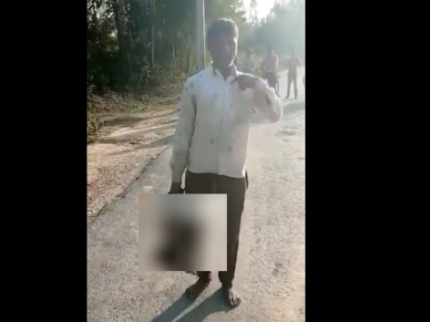 <p>Trigger Warning: A man walks to police station holding severed head of his daughter in northern India, arrested by police</p> (Screengrab/Video )