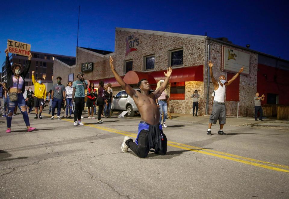 Marcus Lavon of Des Moines raises his hands during a protest on Friday, May 29, 2020, in Des Moines. The protests were a response to the recent death of George Floyd, a Minneapolis man who was killed by a Minneapolis police officer. 