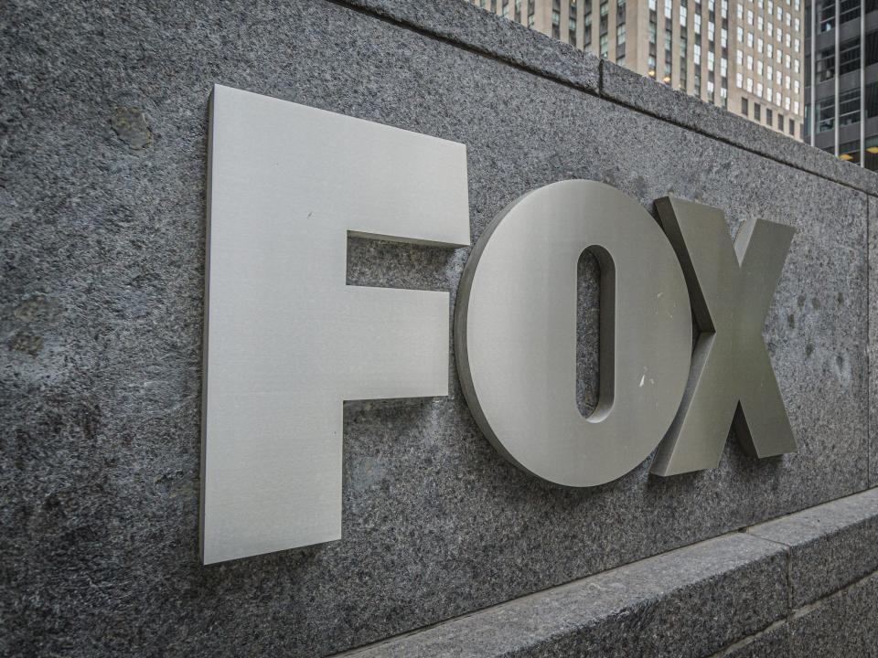 Grey plaque that says "Fox" at the entrance to Fox News headquarters in New York