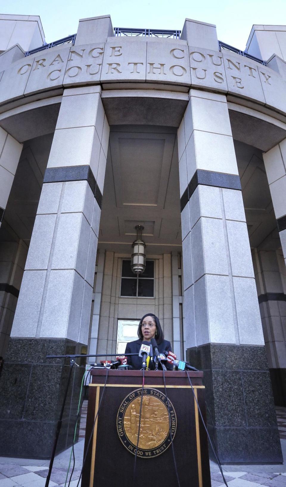 In a press conference Thursday, March 16, 2017, on the steps of the Orange County Courthouse, Orange-Osceola State Attorney Aramis Ayala announces that her office will no longer pursue the death penalty as a sentence in any case brought before the 9th Judicial Circuit of Florida. (Joe Burbank/Orlando Sentinel via AP)