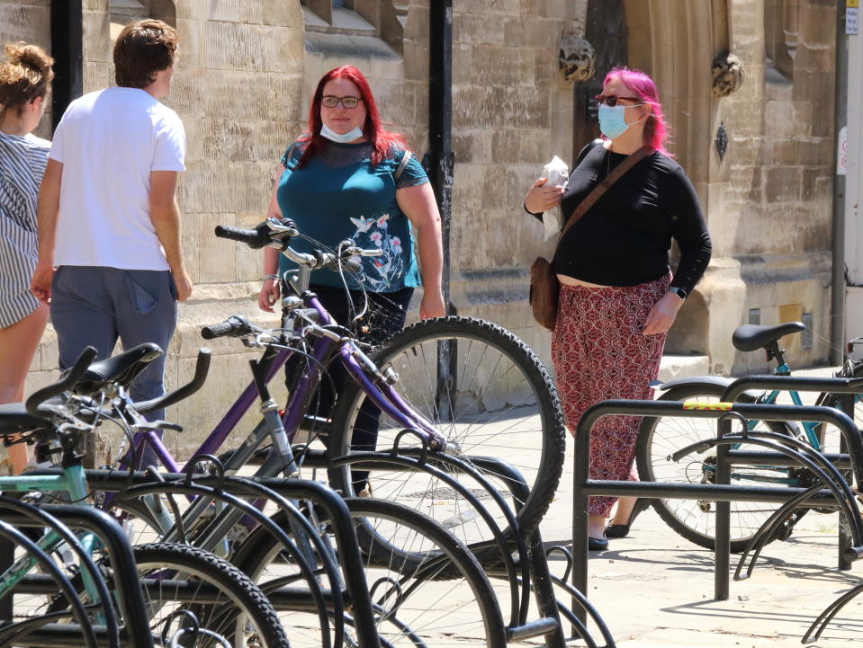  Women wearing face masks as a preventive measure walk on the street. The UK government relaxed the guidelines on coronavirus lockdown, allowing people to spend more time outdoor as the death rate continues to drop. (Photo by Keith Mayhew / SOPA Images/Sipa USA) 